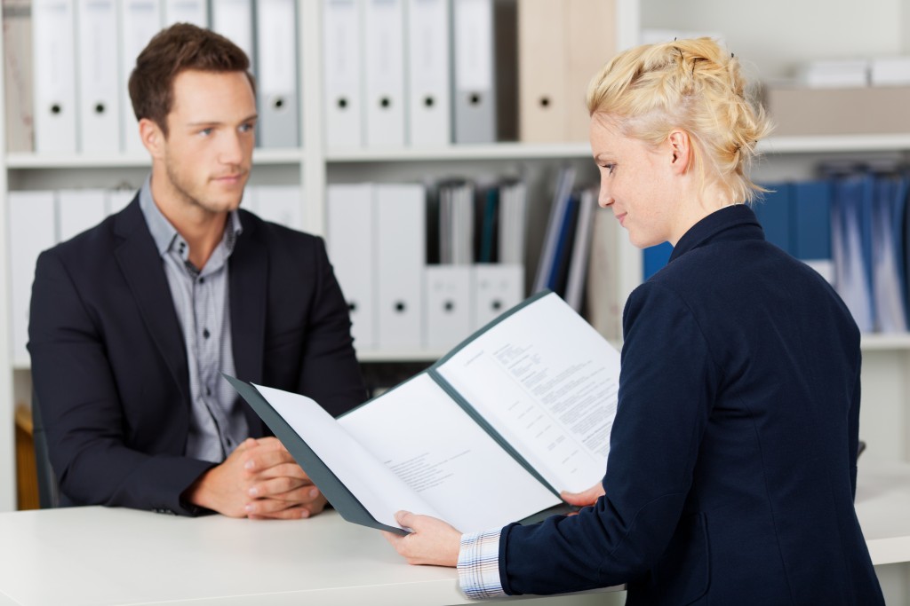 woman reviewing the documents applicant