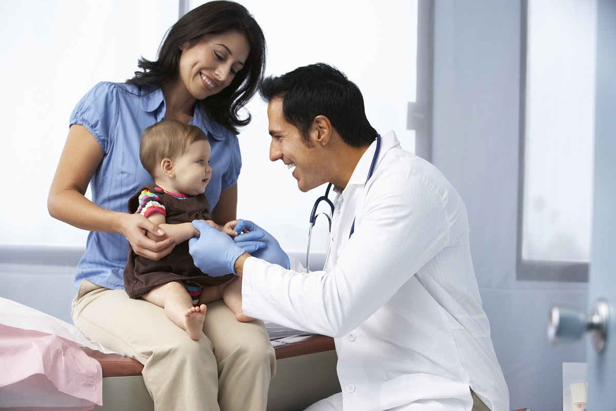 doctor playing with baby