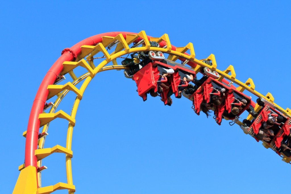 Rollercoaster ride against blue sky