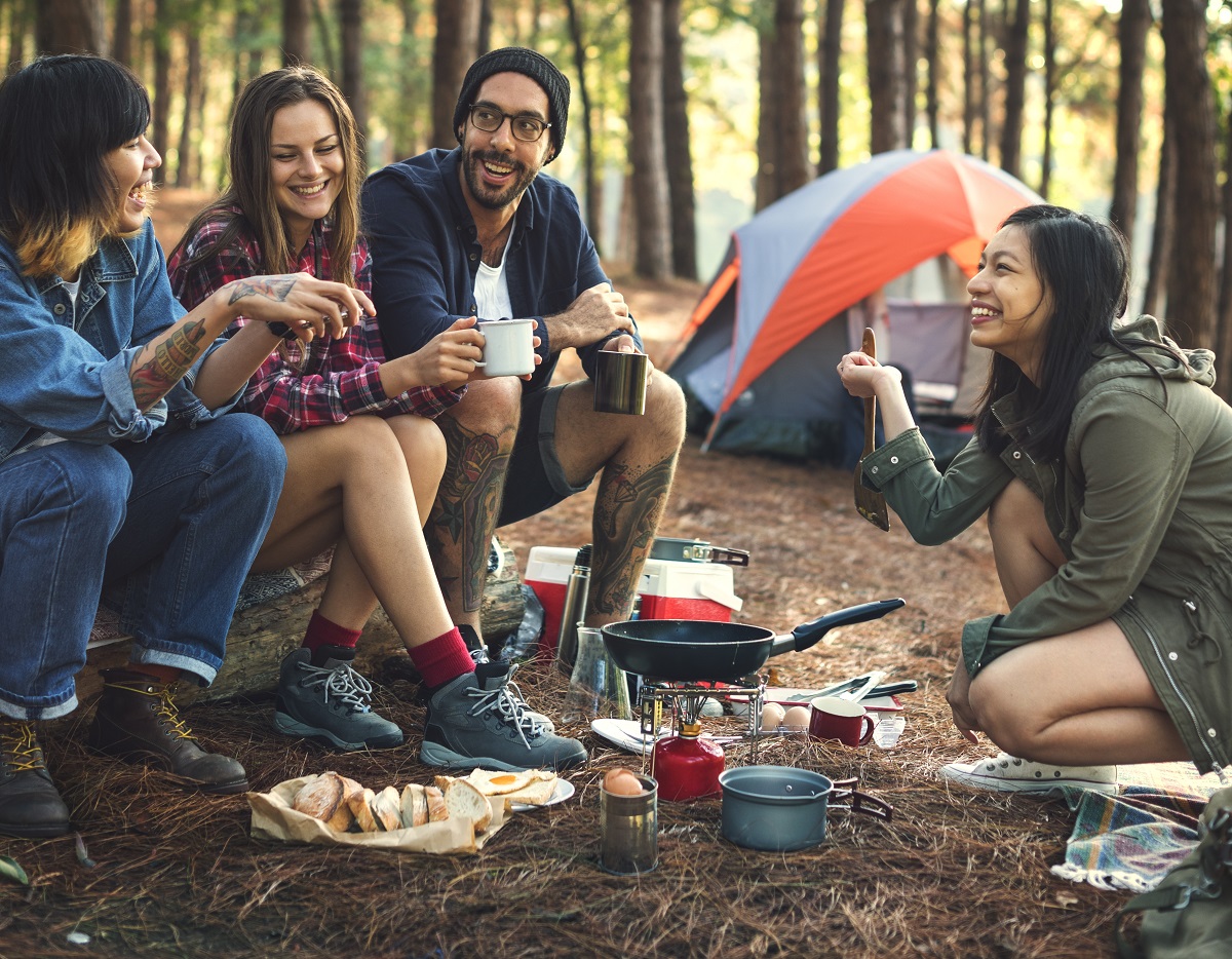 Friends camping and eating