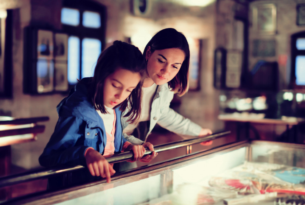 child looking at collection