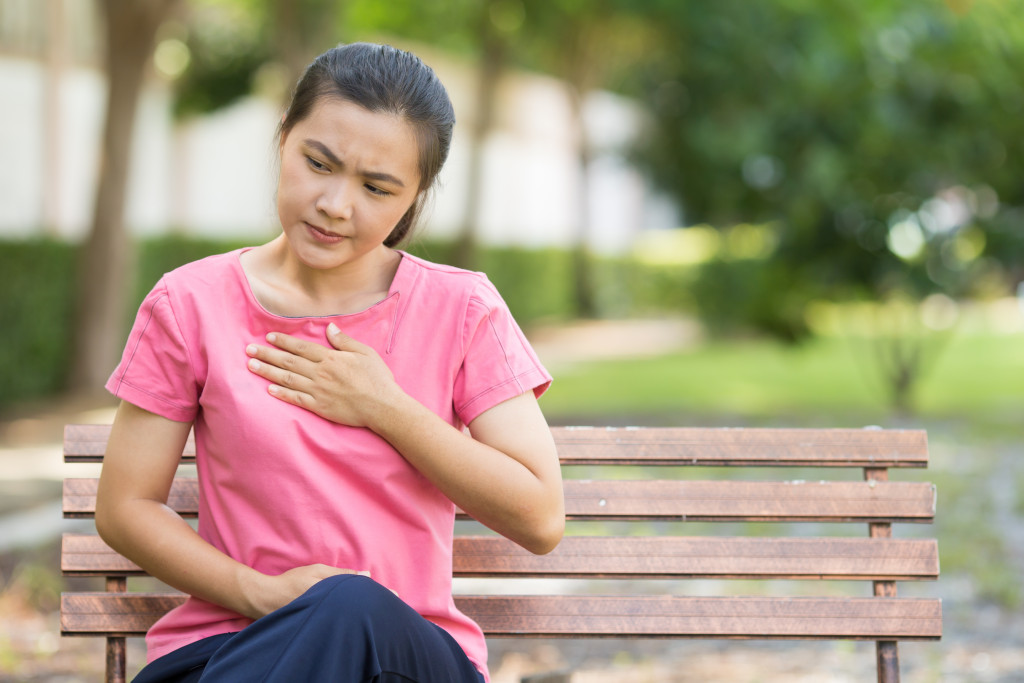 Woman has reflux acids in the garden