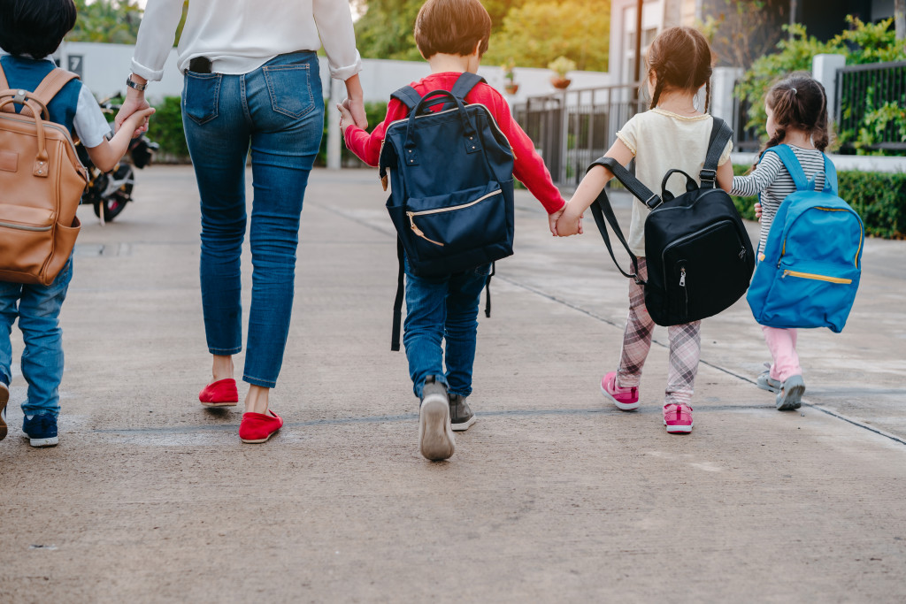 mom walking kids to school