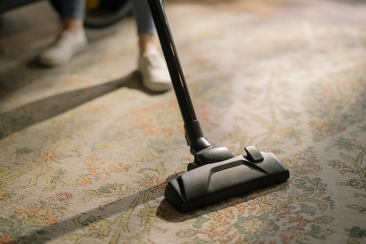 Black Vacuum Cleaner on Area Rug