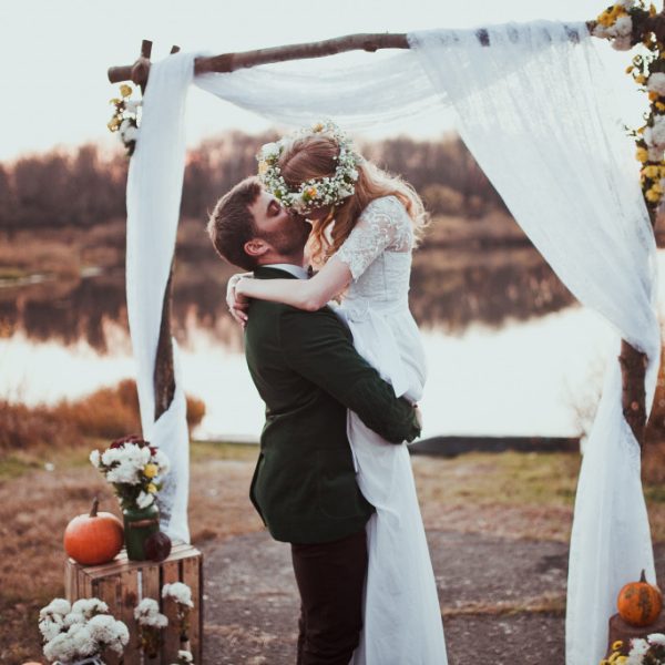 groom kissing his bride in altar