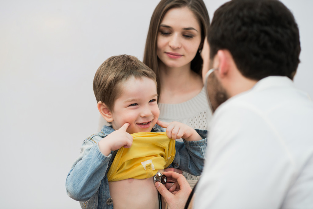 a doctor checking baby's health